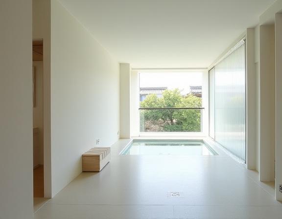 A minimalist room at Beniya Mukayu with an open-air bath on the balcony.